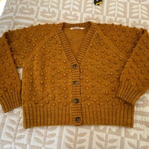 Misha & Puff women’s v-neck cardigan, marigold, merino wool.